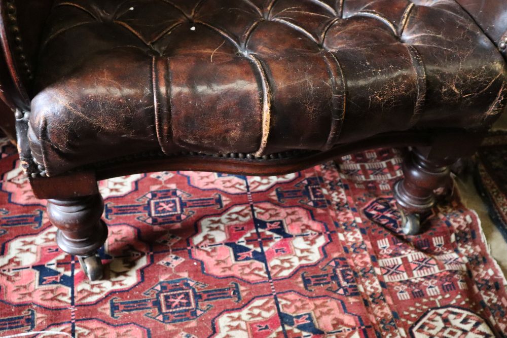 A Victorian mahogany library chair, upholstered in buttoned brown leather, width 64cm height 90cm